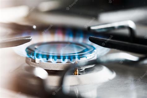 Premium Photo | Burning gas burner on the stove