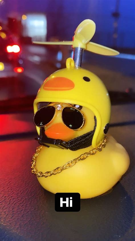 A Yellow Rubber Duck With Sunglasses And A Chain Around Its Neck