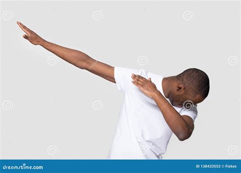 Happy Black Man Making Dab Gesture On Blank Studio Background Stock