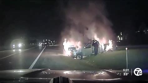 Video Fraser Police Officer Saves Woman From Burning Vehicle