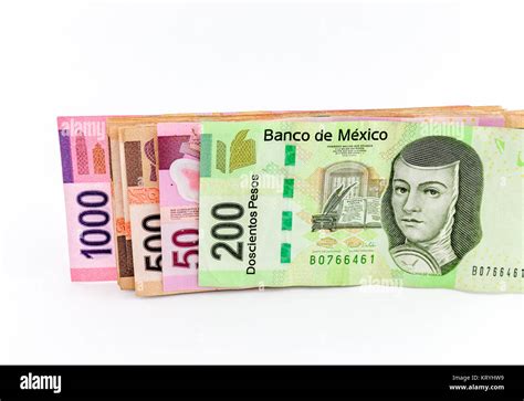 Four Mexican Peso Banknotes Of Various Denominations Over White Stock