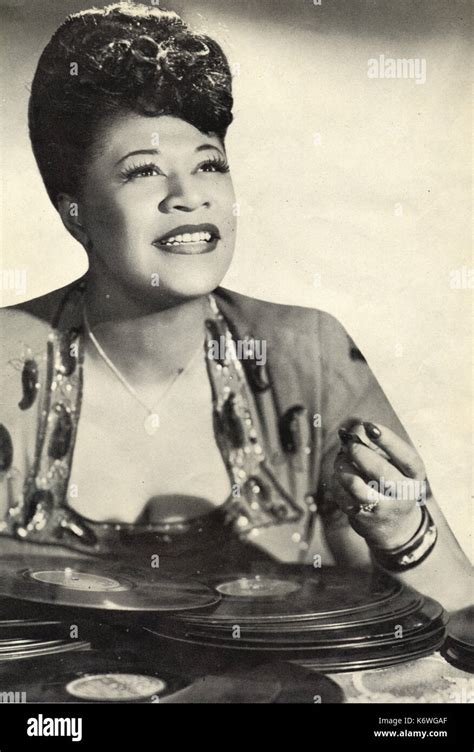 Fitzgerald Ella With Pile Of Records In Front Of Her In 1940s American