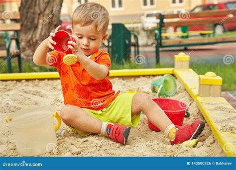 Little Boy on Playground. Playing Child in Sandbox Stock Photo - Image ...