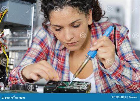 Young Female Electronic Engineer Soldering Computer Parts Stock Image