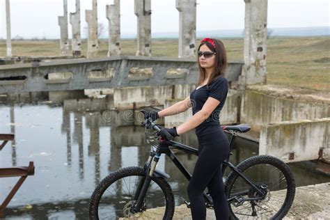 Girl On A Mountain Bike On Offroad Beautiful Portrait Of A Cyclist In