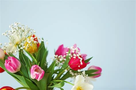 Premium Photo Bouquet Of Beautiful Colorful Tulips On Light Blue Wall