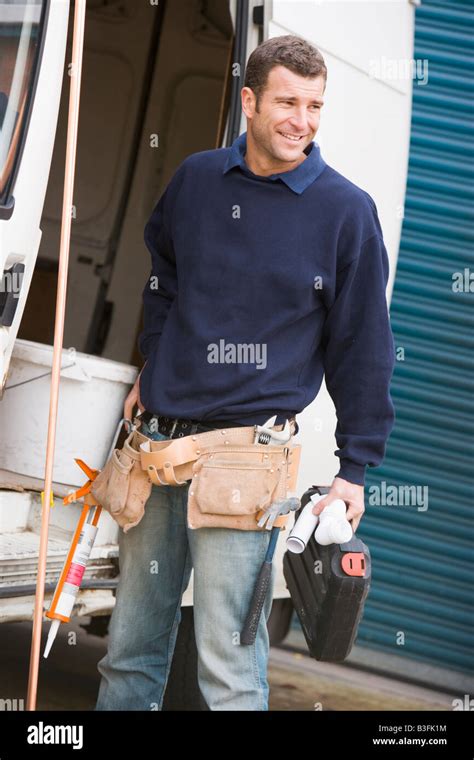 Plumber Standing With Van Smiling Stock Photo Alamy