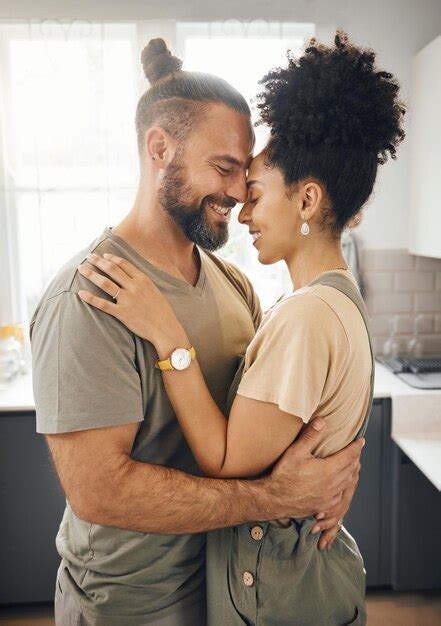 Premium Photo Interracial Couple Hug And Forehead Touch In Kitchen