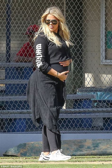 Pregnant Khloe Kardashian Cradles Her Growing Bump Daily Mail Online