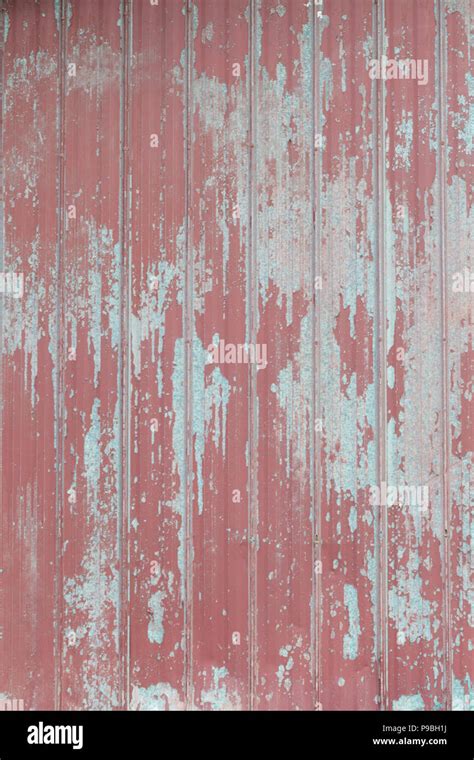 Faded Peeling Rusty Steel Sheets With Oxblood Red Paint Grunge