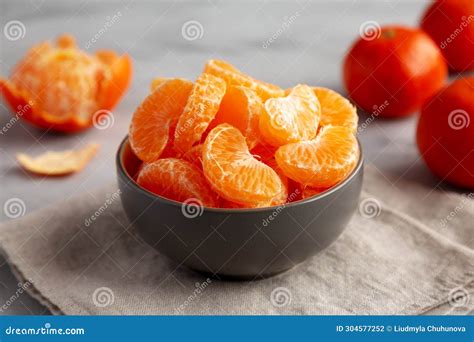 Organic Peeled Mandarin Oranges In A Bowl Side View Stock Photo