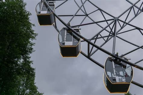 Premium Photo Glowing Cabins Of A Ferris Wheel Against The Evening Sky