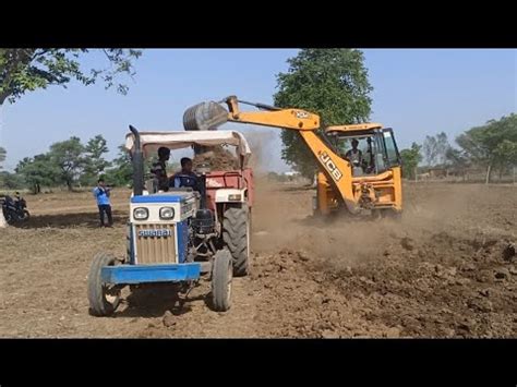 Mahindra Hy Tec Sarpanch Tractor In The River For Jcb Dx Loading