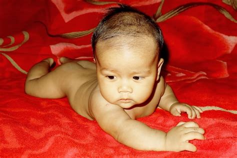 Premium Photo Naked Cute Baby Boy Lying On Bed