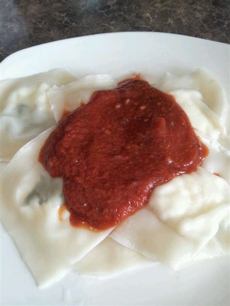 Wonton wrapper ravioli, stuffed with ricotta and fresh basil, with a marinara sauce Wonton ...