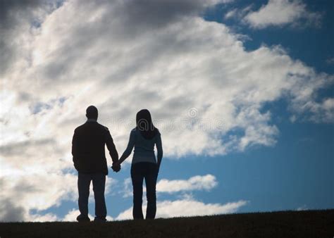 Holding Hands in a Silhouette Stock Photo - Image of beauty, couple: 653992