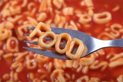 Spaghetti Letter Spelling The Word Food With The Letters Held Up On A