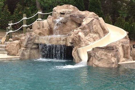 Custom Grotto Waterfall with Slide - RicoRock®, Inc.