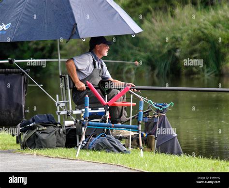 Man pole fishing on the Bude Canal, Cornwall, UK Stock Photo - Alamy