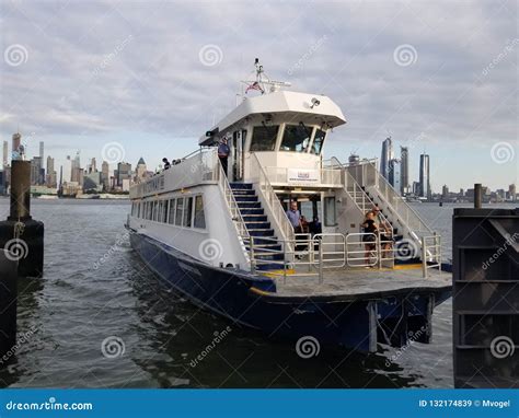 Ferry Boat On The Hudson River In New Jersey With New York City In The