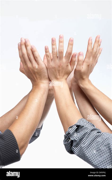 Businessmen S Hands Gethered Up Together In The Air As If Holding