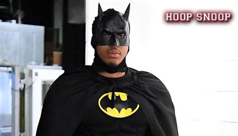 Grant Williams addresses media in Batman costume