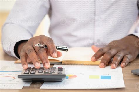 African Black Businessman Sitting Doing A Financial Report And Studying