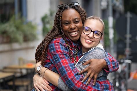 Premium Photo Portrait Of Two Interracial Best Friends Girls Hugging