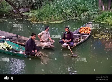 Floating Market Vendors Enjoying A Smoke Dal Lake Srinagar Kashmir