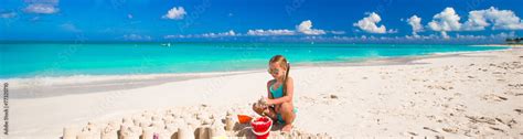 Little girl playing with beach toys during tropical vacation Stock ...