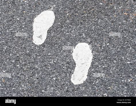 Painted Footsteps On Pavement Stock Photo Alamy