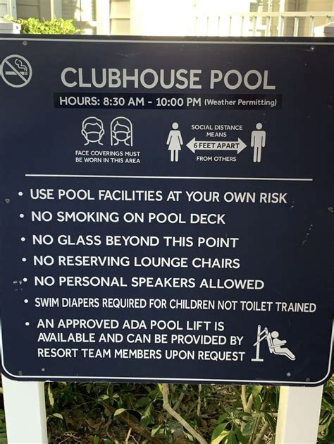 A Sign Warning People To Keep Swimming In The Pool And Not Using Their