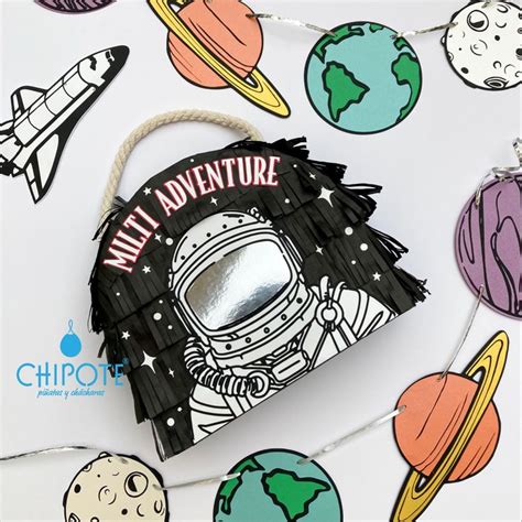 An Ornament With Space Themed Items On It