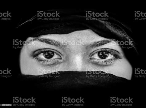 Portrait Of Beautiful Arab Woman Wearing Black Scarf In Black And White