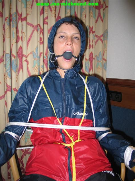 Get Pictures With Angelique Tied And Gagged In Shiny Nylon Rainwear From