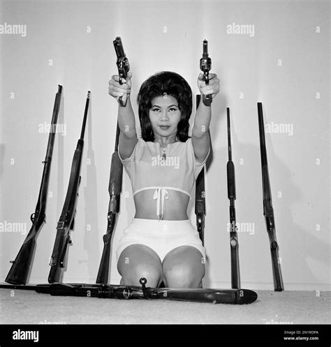 Actress Linda Ho takes aim with a Colt Frontier pistol and a 38-caliber ...