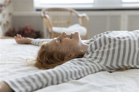 close  side view blissful woman lying   bed stock image image