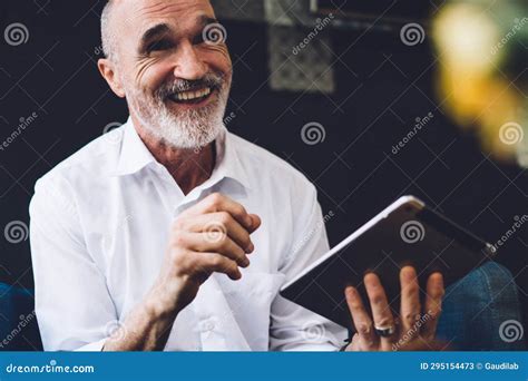 Happy Senior Man Looking Away While Holding Tablet Stock Image Image