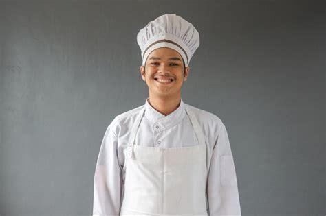 Premium Photo Portrait Of Happy Male Chef In White Toque And Apron