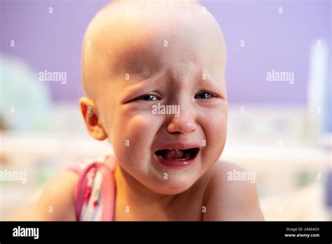 The Baby Is Upset Crying Girl Crying While Standing In Her Crib Face