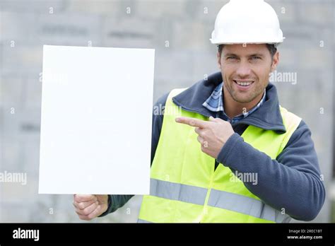 Engineer Man Construction Worker Holding Blank Advertising Banner Stock