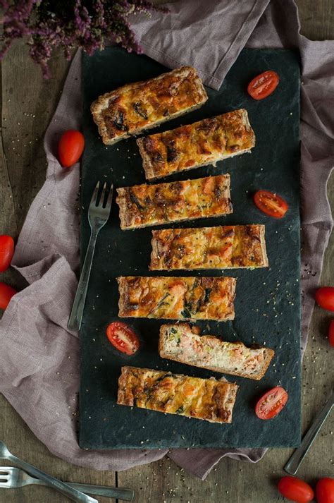 Slices Of Bread With Tomatoes And Herbs On A Slate Board Next To Utensils