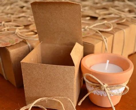 A Candle And Some Brown Paper Bags On A Table