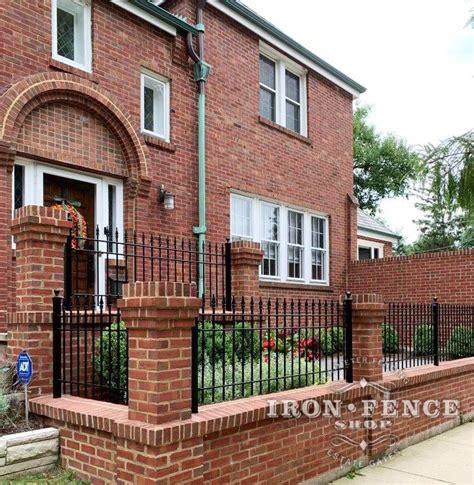 A Beautiful Combination Iron Fence With Brick Walls And Brick Columns