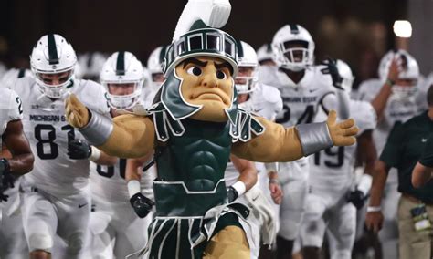 MSU Football unveils State script helmet with basketball hype video