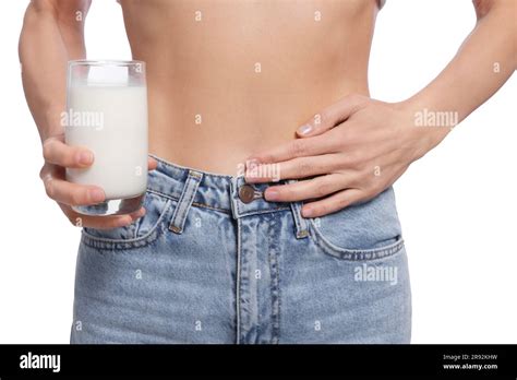 Woman With Glass Of Milk Suffering From Lactose Intolerance On White