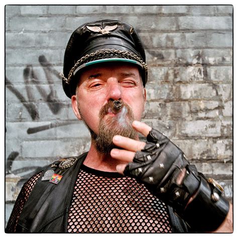 A Leather Daddy Smokes A Large Cigar While Posing For A Photo At Toronto Gay Pride