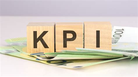 Kpi Acronym Key Performance Indicators Text On Wood Cubes With Euro