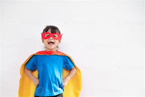 Funny Little Girl Playing Power Super Hero Over White Background