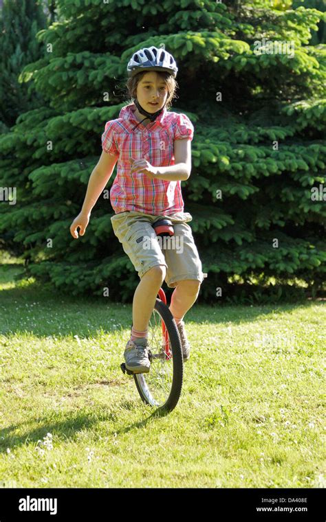 Young Girl On A Unicycle Stock Photo Alamy